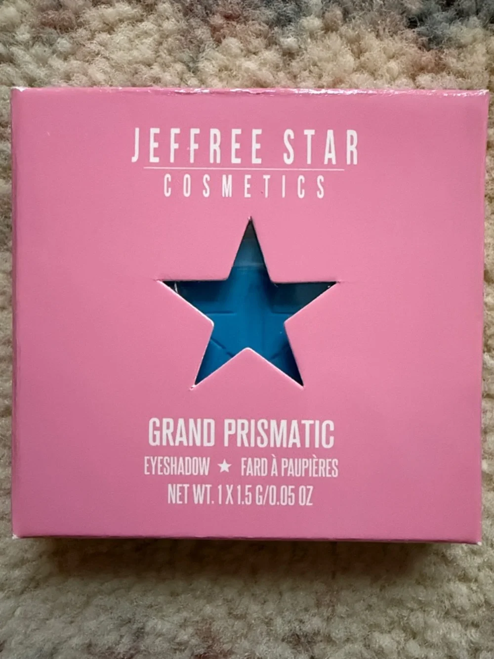 Jeffree Star Grand Prismatic Eyeshadow in Pink Packaging with Bright Blue Shade